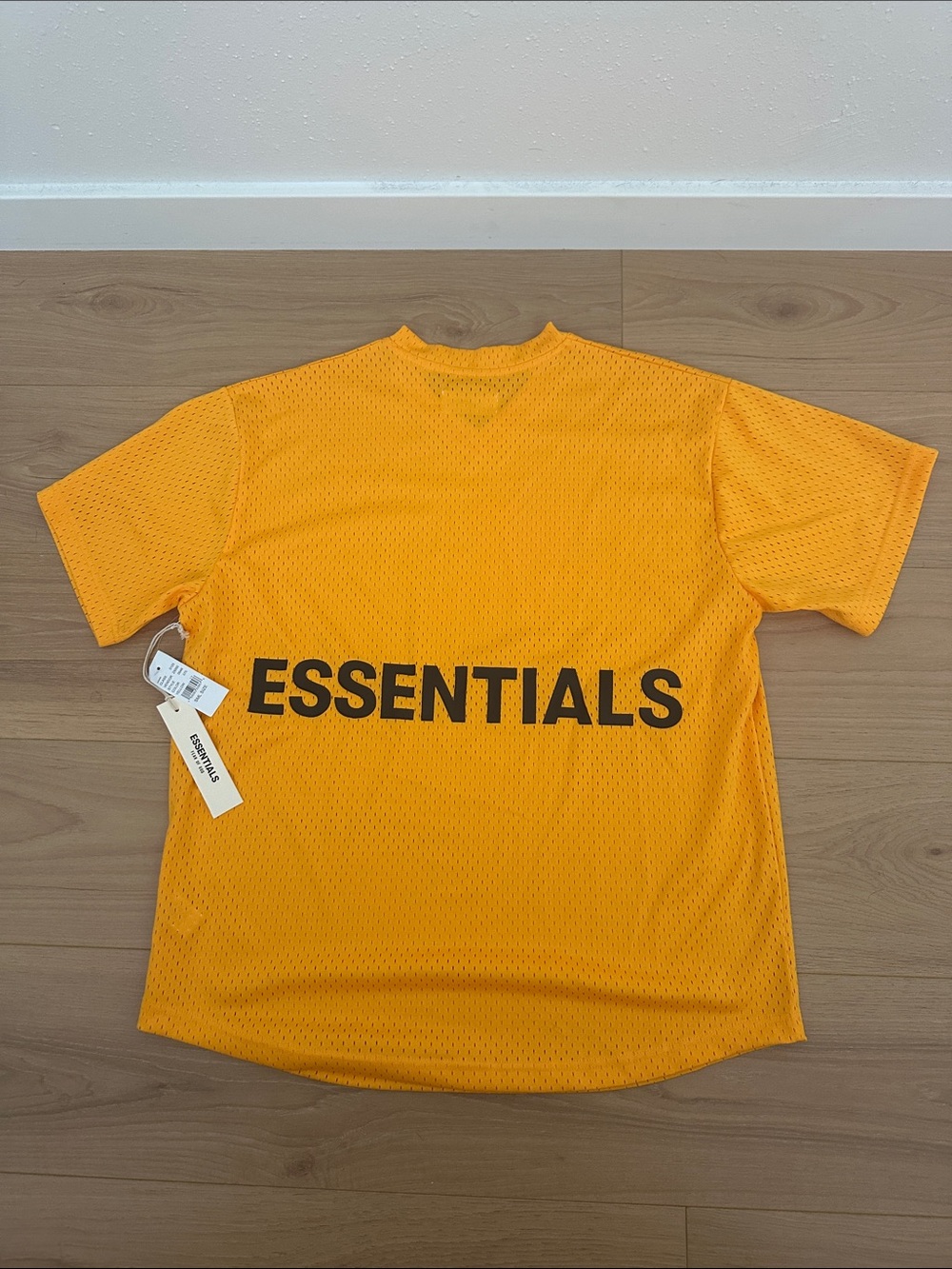ESSENTIALS Men's Short Sleeve Mesh Tee in Orange with Black Logo